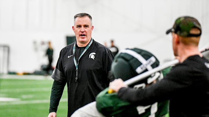 Michigan State's head coach Pat Fitzgerald instructs players. Michigan State's head coach Pat Fitzgerald instructs players.