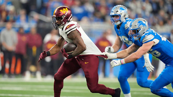 Detroit Lions linebacker Jack Campbell (46) attempts to stop Washington Commanders running back Brian Robinson Jr. (8) as he runs the ball in the first quarter in the NFC divisional round at Ford Field in Detroit on Saturday, Jan. 18, 2025.