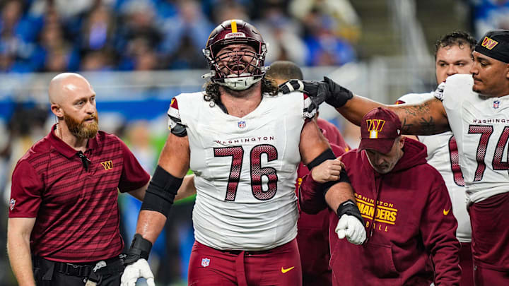Washington Commanders guard Sam Cosmi reacts as he walks off the field in the NFC divisional round.