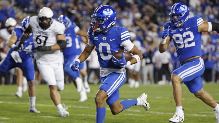 Jakob Robinson (0) runs back an interception for a touchdown against the Cincinnati Bearcats at LaVell Edwards Stadium. Mandatory Credit: Jeff Swinger-USA TODAY Sports
