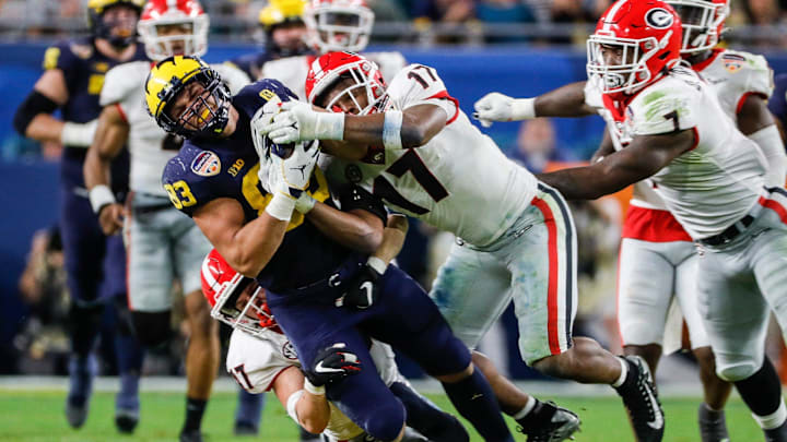 Michigan tight end Erick All (83) makes a catch against Georgia linebacker Nakobe Dean (17) during the second half of the Orange Bowl at Hard Rock Stadium in Miami Gardens, Florida, on Friday, Dec. 31, 2021. Michigan tight end Erick All (83) makes a catch against Georgia linebacker Nakobe Dean (17) during the second half of the Orange Bowl at Hard Rock Stadium in Miami Gardens, Florida, on Friday, Dec. 31, 2021.