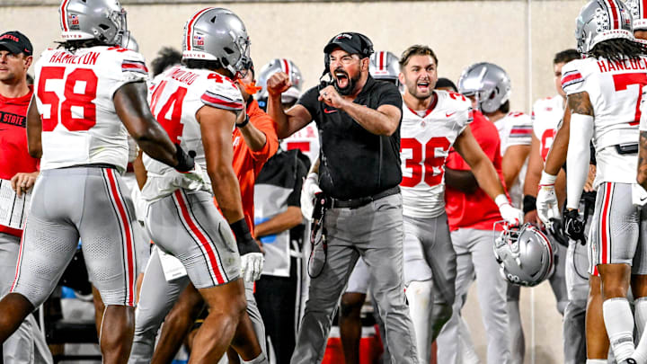 Ohio State's head coach Ryan Day, center, celebrates after the Buckeyes stop Michigan State on fourth down and one yard during the first quarter on Saturday, Sept. 28, 2024, at Spartan Stadium in East Lansing.