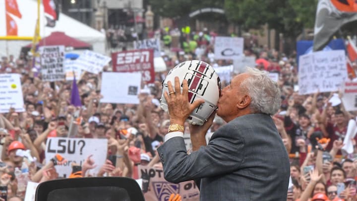 Lee Corso kisses a South Carolina helmet before live broadcast during ESPN Gameday near Williams-Brice Stadium in Columbia, S.C. Saturday, September 14, 2024. Lee Corso kisses a South Carolina helmet before live broadcast during ESPN Gameday near Williams-Brice Stadium in Columbia, S.C. Saturday, September 14, 2024.
