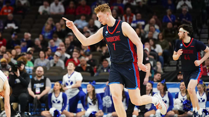 Mar 21, 2024; Omaha, NE, USA; Duquesne Dukes forward Jakub Necas (7) reacts in the first half against the Brigham Young Cougars in the first round of the 2024 NCAA Tournament at CHI Health Center Omaha. Mandatory Credit: Dylan Widger-Imagn Images
