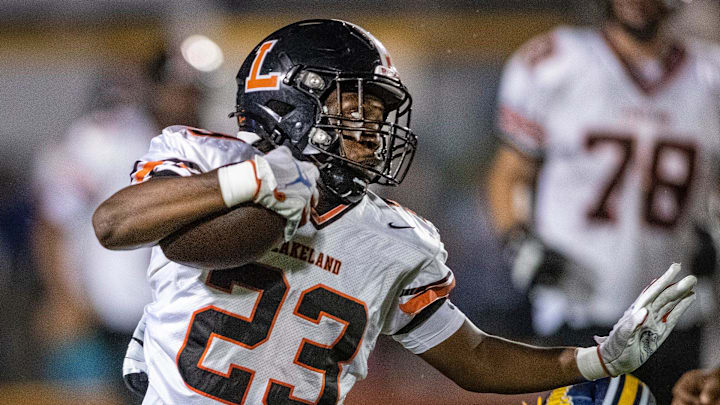 Lakeland Dreadnaughts (23) Jordan Henderson eludes a tackle from Winter Haven defense during first half action at Denison Stadium Friday September 13 2024, in Winter Haven Fl.
Ernst Peters/The Ledger