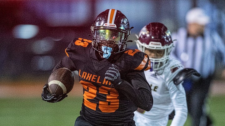 Lakeland Dreadnaughts (23) Jordan Henderson runs away from a Niceville defender Friday December 6 , 2024 in Lakeland Fl.
Ernst Peters/The Ledger