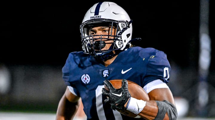 East Lansing's Jace Clarizio runs for a touchdown against Grand Ledge during the fourth quarter on Friday, Sept. 13, 2024, at East Lansing High School.