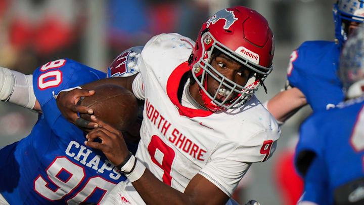 North Shore quarterback Kaleb Bailey (9) runs the ball through the Westlake defense in the second quarter of the 6A UIL high school football semifinal game at the Pfield in Pflugerville, Saturday, December 9, 2023. North Shore defeated Westlake 23-14, knocking them out of the playoffs.