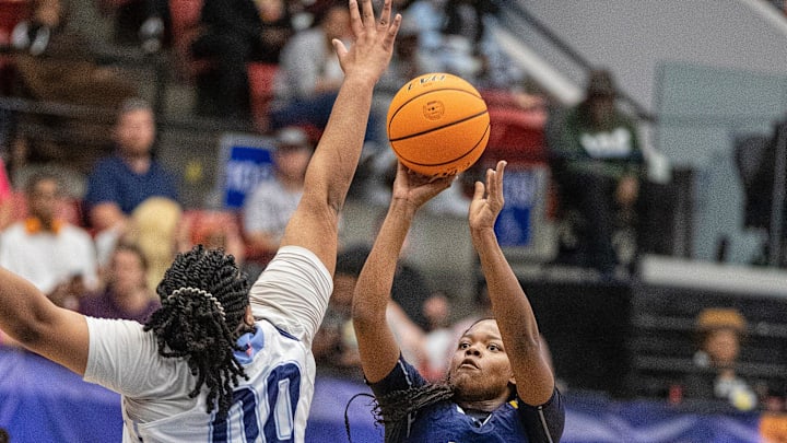 Winter Haven Blue Devils (13) Serenity Hardy goes upm for the shot over Dr. Phillips Panthers (00) Elise Horne during the FHSAA 7A Girls State semifinal game at the RP Funding Center in Lakeland Fl. Friday March 8, 2024. Winter Haven fell 65-62 to Dr. Phillips.
Ernst Peters/The Ledger