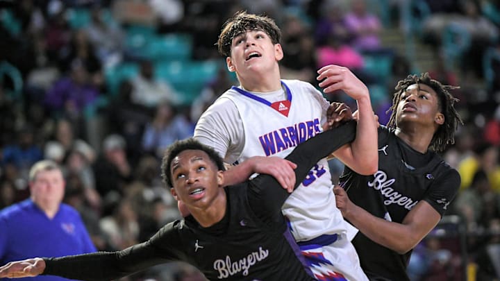 Riverside's Julen Iturbe (32) looks at a free throw near Ridge View High guard Robert Wylie (2) and Yale Davis (1) during the third quarter of the 2024 South Carolina High School 4A Basketball Championship game at the Florence Center in Florence, S.C. Saturday, March 2, 2024. Ridge View High won 58-52.