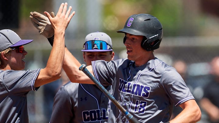 Fort Collins' Max Bronson celebrates with his team after scoring a run during a Colorado Class 5A state baseball tournament game against Regis Jesuit.