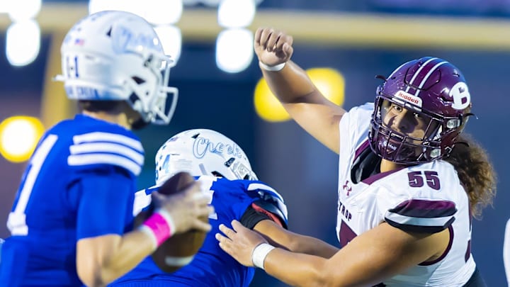 Bastrop Bears defensive lineman Tiki Hola (55) rushes toward Cedar Creek Eagles quarterback Blaze Orr (11 in the first quarter )at the District 13-5A football game on Friday, October 6, 2023, at Bastrop Memorial Stadium - Bastrop, Texas. Bastrop Bears defensive lineman Tiki Hola (55) rushes toward Cedar Creek Eagles quarterback Blaze Orr (11 in the first quarter )at the District 13-5A football game on Friday, October 6, 2023, at Bastrop Memorial Stadium - Bastrop, Texas.