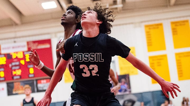 Fossil Ridge's Malachai Egbuji looks for a rebound during a city rivalry high school basketball game against Rocky Mountain on Tuesday, Jan. 28, 2025 at Rocky Mountain High School in Fort Collins, Colo.