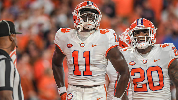 Clemson wide receiver Ajou Ajou (11) and running back Kobe Pace (20) celebrate after teammate wide receiver Joseph Ngata (10) caught a pass for a touchdown during the second quarter at the Carrier Dome in Syracuse, New York, Friday, October 15, 2021.
Ncaa Football Clemson At Syracuse Clemson wide receiver Ajou Ajou (11) and running back Kobe Pace (20) celebrate after teammate wide receiver Joseph Ngata (10) caught a pass for a touchdown during the second quarter at the Carrier Dome in Syracuse, New York, Friday, October 15, 2021.
Ncaa Football Clemson At Syracuse