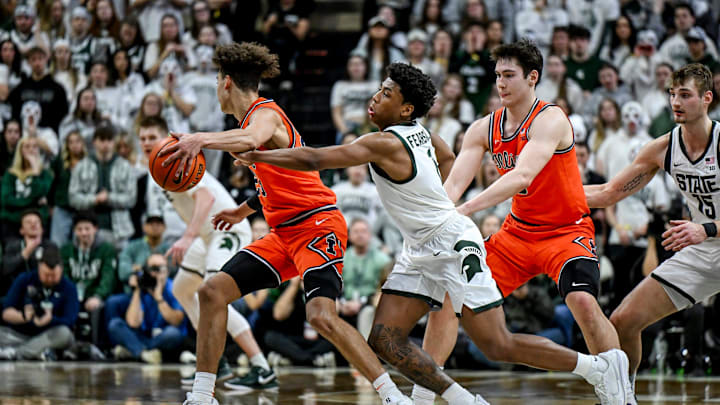 Michigan State's Jeremy Fears Jr., right, fouls Illinois' Keaton Wagler during the first half on Saturday, Feb. 7, 2026, at the Breslin Center in East Lansing.