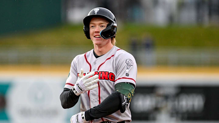 Lugnuts' Henry Bolte smiles after an out in the second inning on Wednesday, April 3, 2024, during the Crosstown Showdown against Michigan State at Jackson Field in Lansing.
