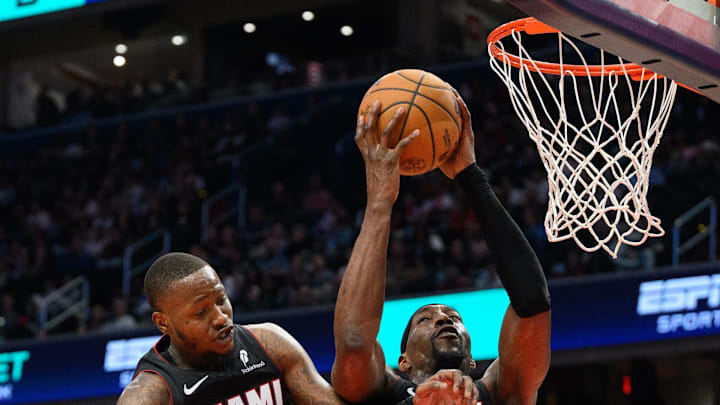 Mar 31, 2025; Washington, District of Columbia, USA; Miami Heat center Bam Adebayo (13) rebounds the ball with guard Terry Rozier (2) during the third quarter against the Washington Wizards at Capital One Arena. Mandatory Credit: Reggie Hildred-Imagn Images