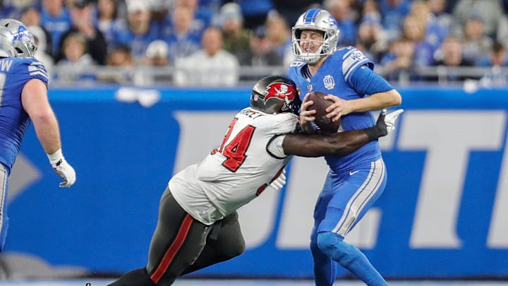 Jan 21, 2024; Detroit, Michigan, USA; Detroit Lions quarterback Jared Goff (16) is sacked by Tampa Bay Buccaneers defensive tackle Calijah Kancey (94) during the first half in a 2024 NFC divisional round game at Ford Field. Mandatory Credit: Junfu Han-Imagn Images