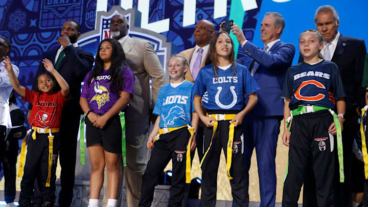 Former NFL players and some hall of famers are introduced with girls flag football members before the start of the second round of 2024 NFL draft in Detroit on Friday, April 26, 2024. Former NFL players and some hall of famers are introduced with girls flag football members before the start of the second round of 2024 NFL draft in Detroit on Friday, April 26, 2024.