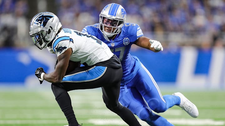 Lions linebacker Anthony Pittman tackles Panthers punt return Ihmir Smith-Marsette during the second half of the Lions' 42-24 win on Sunday, Oct. 8, 2023, at Ford Field.