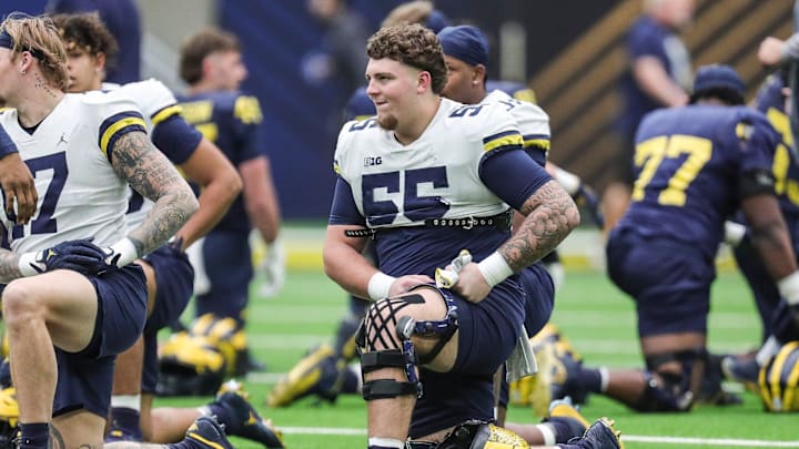 Michigan players include defensive lineman Mason Graham stretches and warms up during open practice at NRG Stadium in Houston on Saturday, Jan. 6, 2024. Michigan players include defensive lineman Mason Graham stretches and warms up during open practice at NRG Stadium in Houston on Saturday, Jan. 6, 2024.