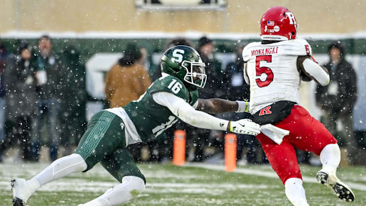 Michigan State's Jaylen Thompson, left, tries to tackle Rutgers' Kyle Monangai during the second quarter on Saturday, Nov. 30, 2024, at Spartan Stadium in East Lansing.