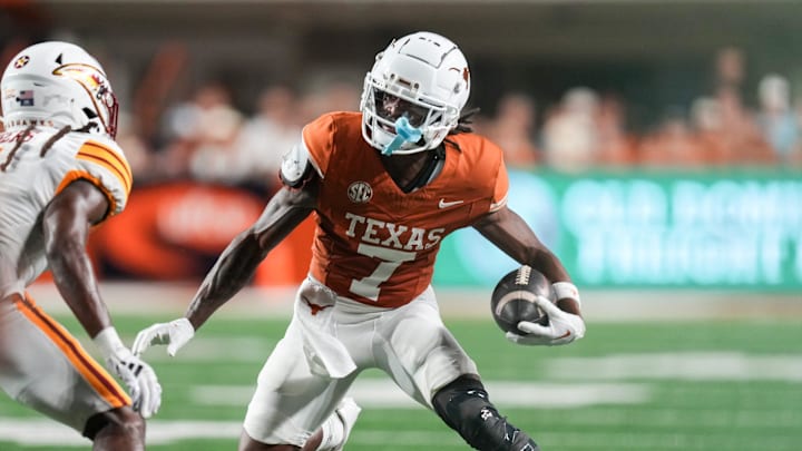 Texas Longhorns wide receiver Isaiah Bond (7) runs the ball forward as the Texas Longhorns take on ULM at Darrell K Royal-Texas Memorial Stadium in Austin Saturday, Sept. 21, 2024.
