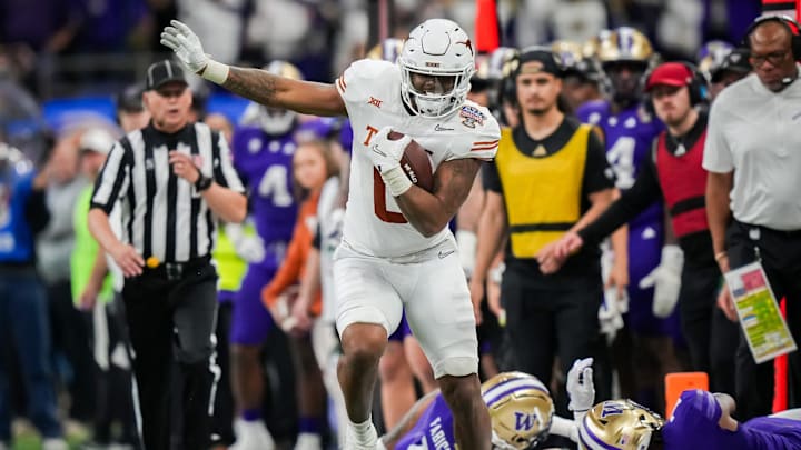 Texas Longhorns tight end Ja'Tavion Sanders (0) evades the Washington Huskies defense during the Sugar Bowl College Football Playoff semi-finals at the Ceasars Superdome in New Orleans, Louisiana, Jan. 1, 2024. The Huskies won the game over the Texas Longhorns 37-31. Texas Longhorns tight end Ja'Tavion Sanders (0) evades the Washington Huskies defense during the Sugar Bowl College Football Playoff semi-finals at the Ceasars Superdome in New Orleans, Louisiana, Jan. 1, 2024. The Huskies won the game over the Texas Longhorns 37-31.