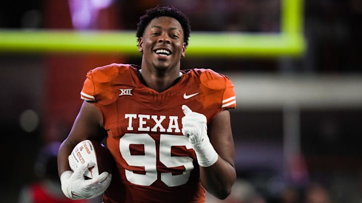 Texas defensive lineman Alfred Collins (95) runs down the field during the Senior Night celebration ahead the Longhorns' game against the Texas Tech Red Raiders, Friday, Nov. 24, 2023 at Darrell K Royal-Texas Memorial Stadium in Austin.