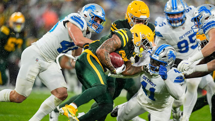 Green Bay Packers punt return Keisean Nixon (25) is tackled by Detroit Lions linebacker James Houston (41) and linebacker Jack Campbell (46) during the first half at Lambeau Field in Green Bay, Wis. on Sunday, Nov. 3, 2024.