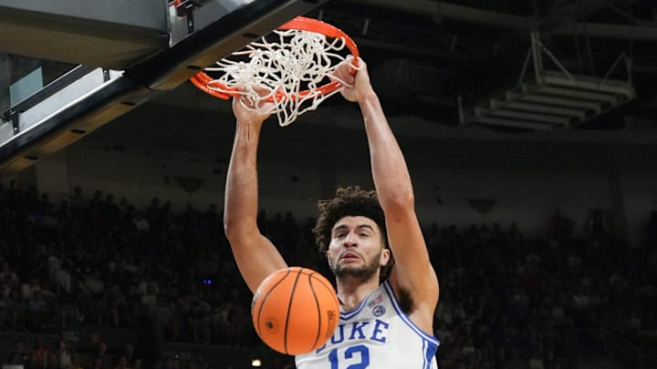 Duke Blue Devils forward Cameron Boozer (12) dunks March 21, 2026 during the second half of the NCAA Men’s Basketball Tournament second round East Region game with TCU at the Bon Secours Wellness Arena in Greenville, South Carolina.