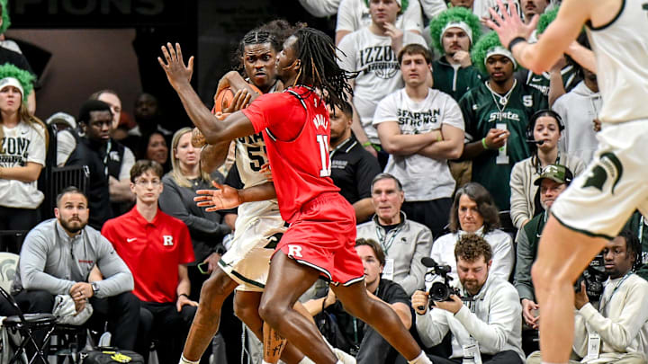 Michigan State's Coen Carr, left, is pressured by Rutgers' Chris Nwuli during the second half on Thursday, March 5, 2026, at the Breslin Center in East Lansing.