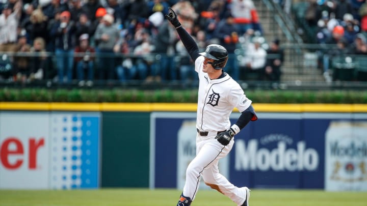 Detroit Tigers designated hitter Mark Canha (21) bats a solo home run against Oakland Athletics