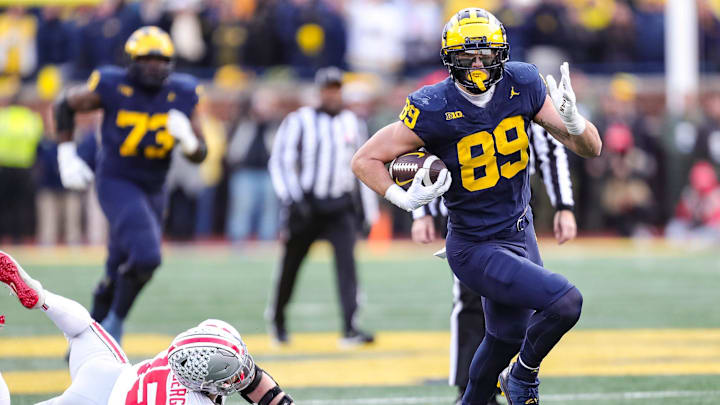 Michigan tight end AJ Barner runs past Ohio State linebacker Tommy Eichenberg during the second half Michigan tight end AJ Barner runs past Ohio State linebacker Tommy Eichenberg during the second half