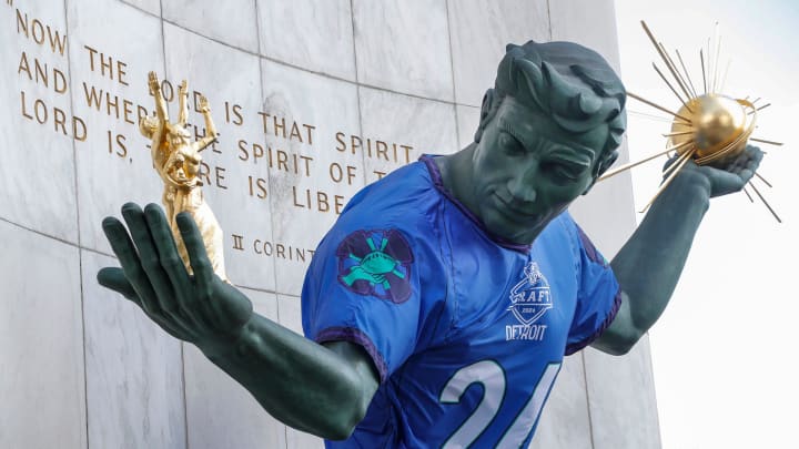 A 2024 NFL draft jersey on the Spirit of Detroit statue in downtown Detroit on Thursday, March 28,