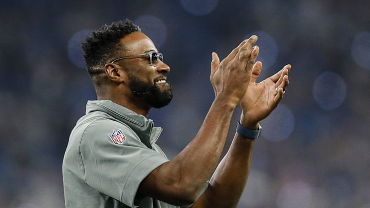 Former Detroit Lions receiver Calvin Johnson waves at fans during the first half against the Tampa Former Detroit Lions receiver Calvin Johnson waves at fans during the first half against the Tampa