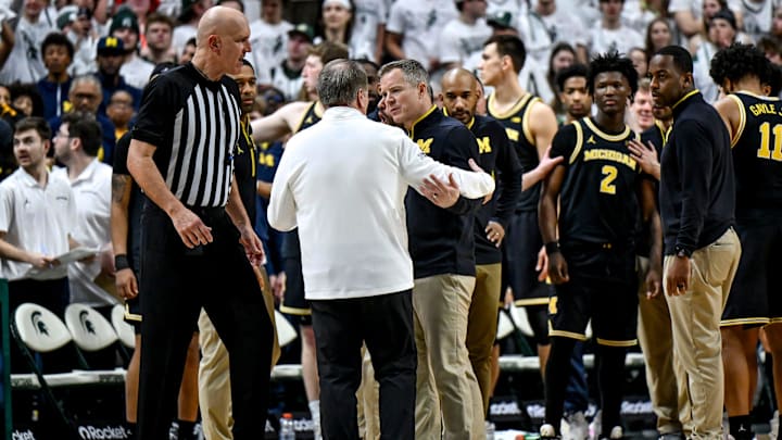 Michigan State's head coach Tom Izzo, left, and Michigan's head coach Dusty May talk it out after a shoving match between players during the second half on Sunday, March 9, 2025, at the Breslin Center in East Lansing. Michigan State's head coach Tom Izzo, left, and Michigan's head coach Dusty May talk it out after a shoving match between players during the second half on Sunday, March 9, 2025, at the Breslin Center in East Lansing.