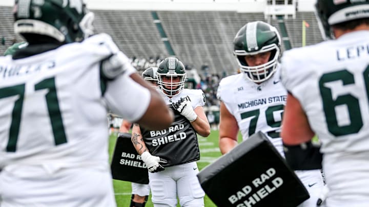 Michigan State's offensive line runs a drill during the Spring Showcase on Saturday, April 20, 2024, at Spartan Stadium in East Lansing.