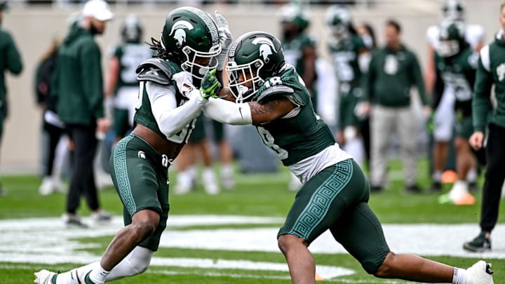 Michigan State's Aveon Grose, left, and Malcolm Jones run a drill during the Spring Showcase on Saturday, April 20, 2024, at Spartan Stadium in East Lansing.