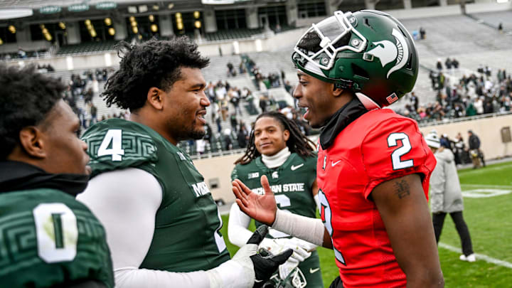 Michigan State's Aidan Chiles, right, talks with Derrick Harmon after the Spring Showcase on Saturday, April 20, 2024, at Spartan Stadium in East Lansing. Michigan State's Aidan Chiles, right, talks with Derrick Harmon after the Spring Showcase on Saturday, April 20, 2024, at Spartan Stadium in East Lansing.