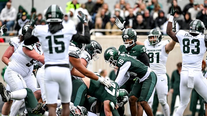 Michigan State's offense celebrates as Jalen Berger scores on a run during the Spring Showcase on Saturday, April 20, 2024, at Spartan Stadium in East Lansing. Michigan State's offense celebrates as Jalen Berger scores on a run during the Spring Showcase on Saturday, April 20, 2024, at Spartan Stadium in East Lansing.