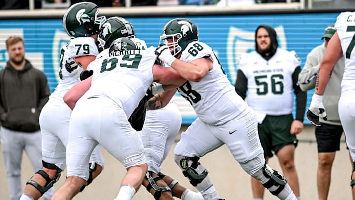 Michigan State's Jacob Merritt, left, and Gavin Broscious run a drill during the Spring Showcase on Saturday, April 20, 2024, at Spartan Stadium in East Lansing.