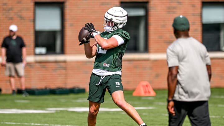 Michigan State's Jack Velling catches a pass during the first day of football camp on Tuesday, July 30, 2024, in East Lansing. Michigan State's Jack Velling catches a pass during the first day of football camp on Tuesday, July 30, 2024, in East Lansing.