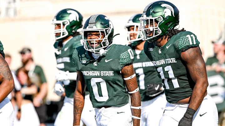 Michigan State's Charles Brantley, left, celebrates with Ken Talley after an interception against Prairie View A&M during the second quarter on Saturday, Sept. 14, 2024, at Spartan Stadium in East Lansing. Brantley's interception was called back on a penalty.