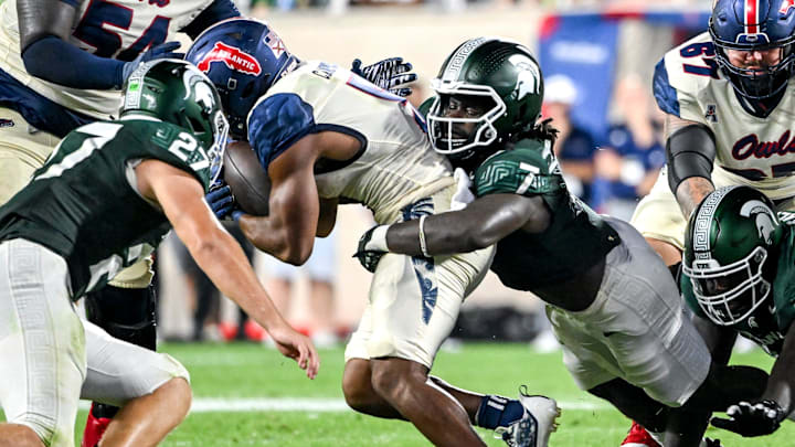 Michigan State's Jordan Turner, right, tackles Florida Atlantic's CJ Campbell, Jr. during the fourth quarter on Friday, Aug. 30, 2024, at Spartan Stadium in East Lansing. Michigan State's Jordan Turner, right, tackles Florida Atlantic's CJ Campbell, Jr. during the fourth quarter on Friday, Aug. 30, 2024, at Spartan Stadium in East Lansing.
