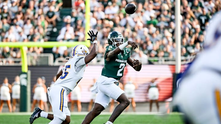 Michigan State's Aidan Chiles, right, throws a pass as Prairie View A&M's Jayven Jackson defends during the third quarter on Saturday, Sept. 14, 2024, at Spartan Stadium in East Lansing.