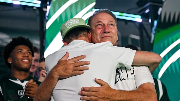 An emotional Tom Izzo, right, hugs his son Steven after learning that his college number is being retired during the Michigan State Madness event on Friday, Oct. 4, 2024, at the Breslin Center in East Lansing.