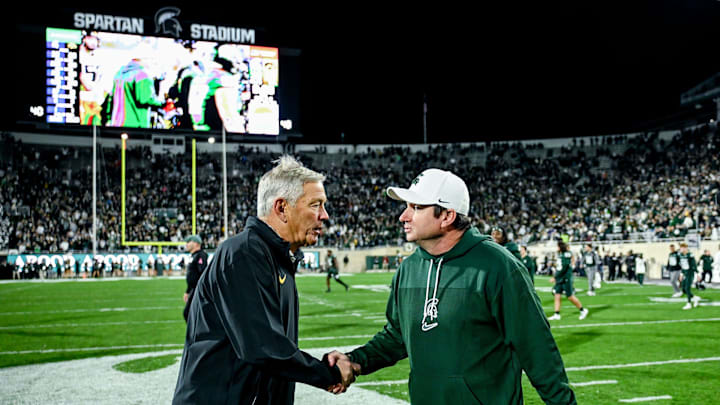 Michigan State's head coach Jonathan Smith, right, shakes hands with Iowa's head coach Kirk Ferentz after the Spartans win on Saturday, Oct. 19, 2024, at Spartan Stadium in East Lansing.
