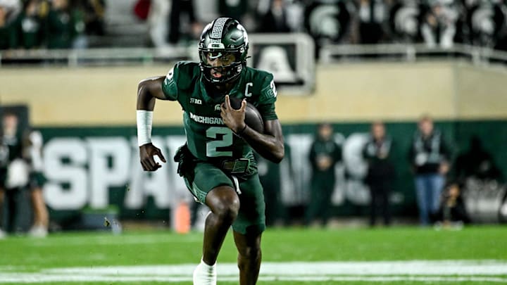 Michigan State's Aidan Chiles runs for a gain against Iowa in the second quarter on Saturday, Oct. 19, 2024, at Spartan Stadium in East Lansing.