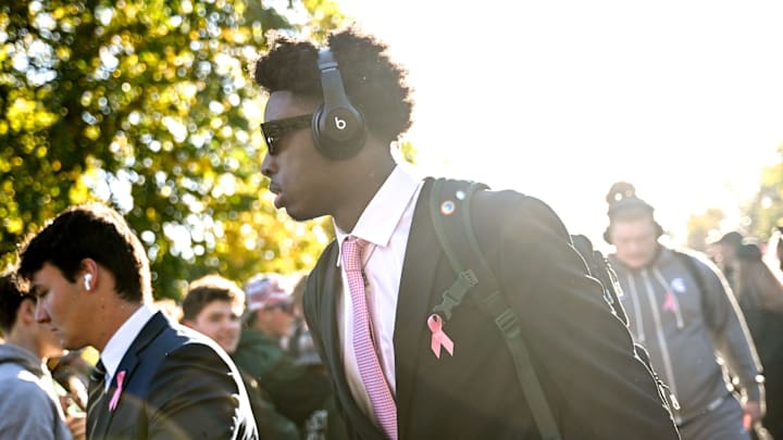 Michigan State's Aidan Chiles walks to the stadium with the team before the game against Iowa on Saturday, Oct. 19, 2024, in East Lansing.